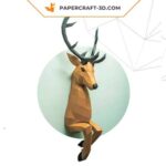 Papercraft deer emerging from wall in 3D origami