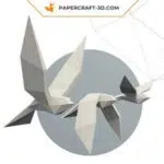 Papercraft de pássaros voando em origami 3D