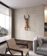 Papercraft deer emerging from wall in 3D origami