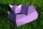 Papercraft fox on rock in 3D origami
