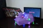 Papercraft de zorro sobre roca en origami 3D