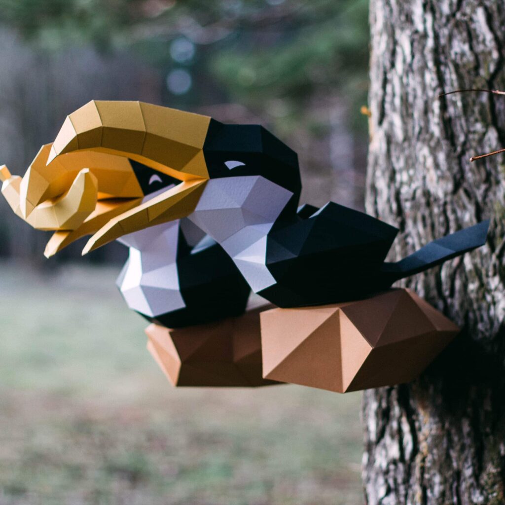 Papercraft de toucans sur branche en origami 3D