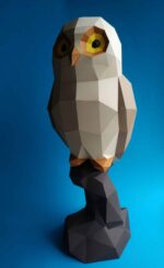 Papercraft owl on branch in 3D origami