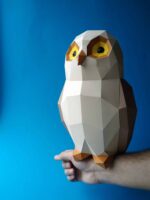 Papercraft owl on branch in 3D origami