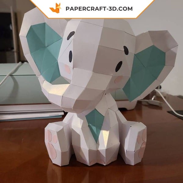 Papercraft cute sitting elephant in origami