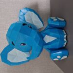 Papercraft cute sitting elephant in origami