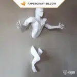 Papercraft man with outstretched arms in origami