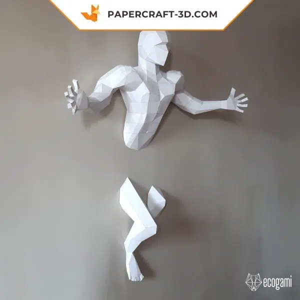 Papercraft man with outstretched arms in origami
