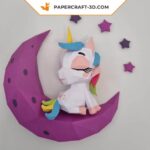 Papercraft baby unicorn on moon in origami