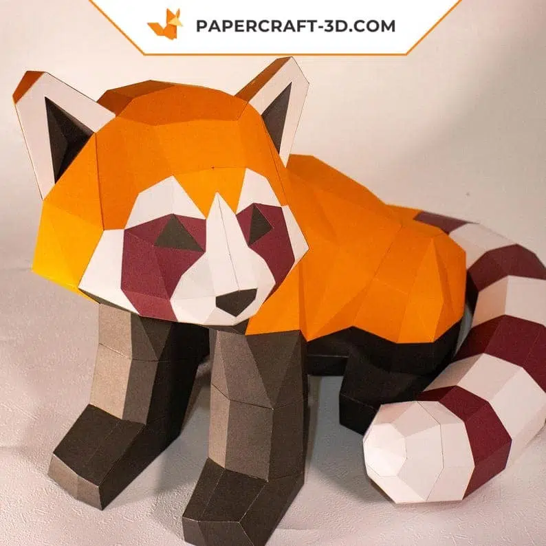 Papercraft panda vermelho sentado em origami
