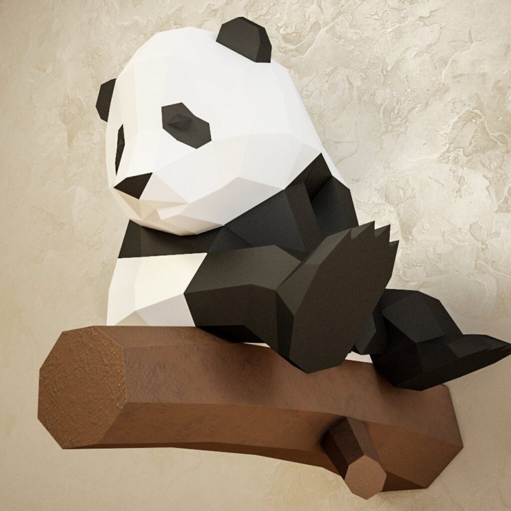 Papercraft panda on branch in 3D origami