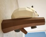 Papercraft panda on branch in 3D origami