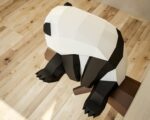 Papercraft panda on branch in 3D origami