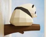Papercraft panda on branch in 3D origami
