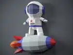 Papercraft de astronauta em foguete em origami 3D
