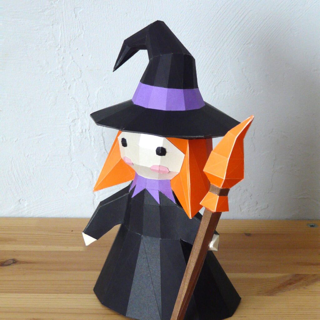 Papercraft of little witch in 3D origami