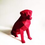 Papercraft eines sitzenden Labradors in Origami