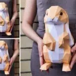 Papercraft di piccoli conigli in piedi in origami 3D