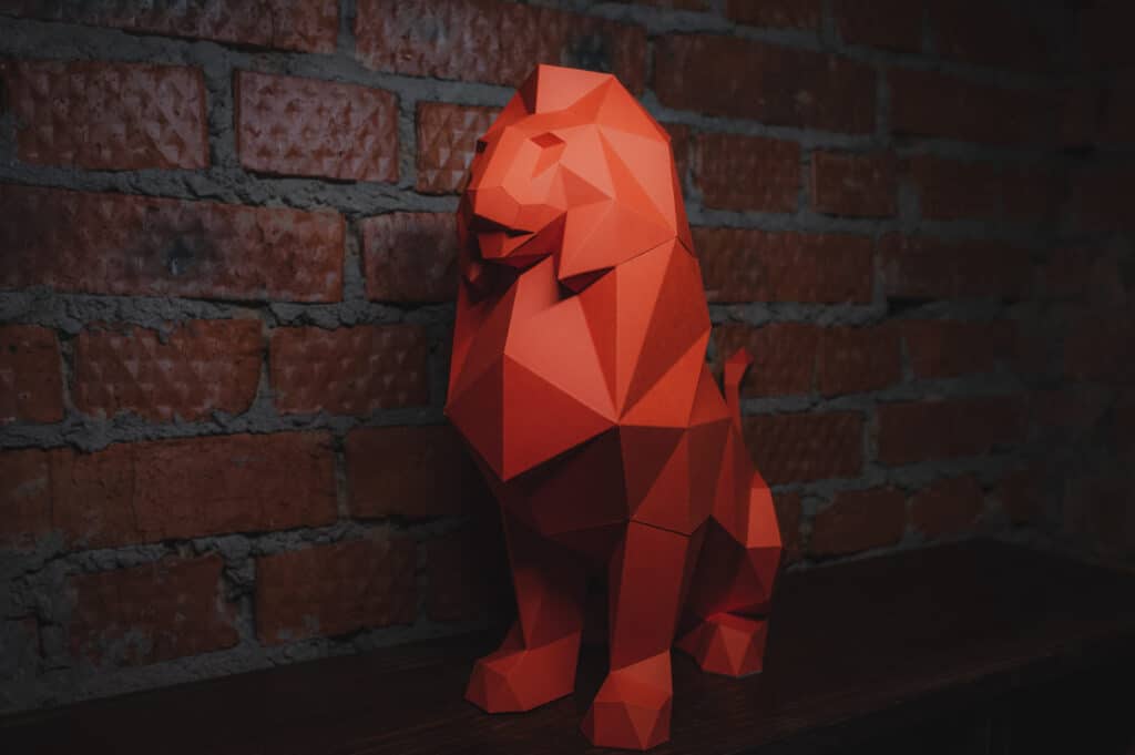 Papercraft of sitting lion in 3D origami