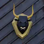 Papercraft eines Stiers auf einem Schild in Origami 3D