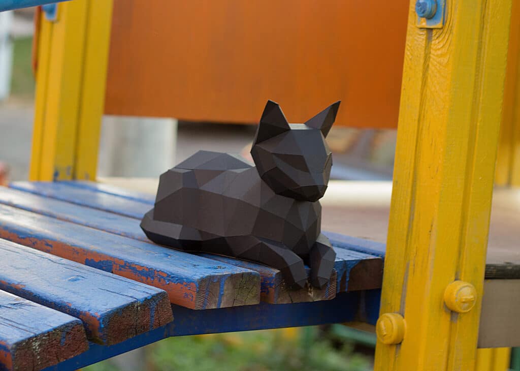 Papercraft of reclining cat in 3D origami