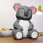 Papercraft di cucciolo di koala con orecchie rosa in origami 3D