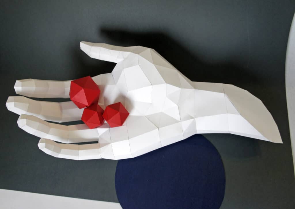 Papercraft of a right hand in origami 3D