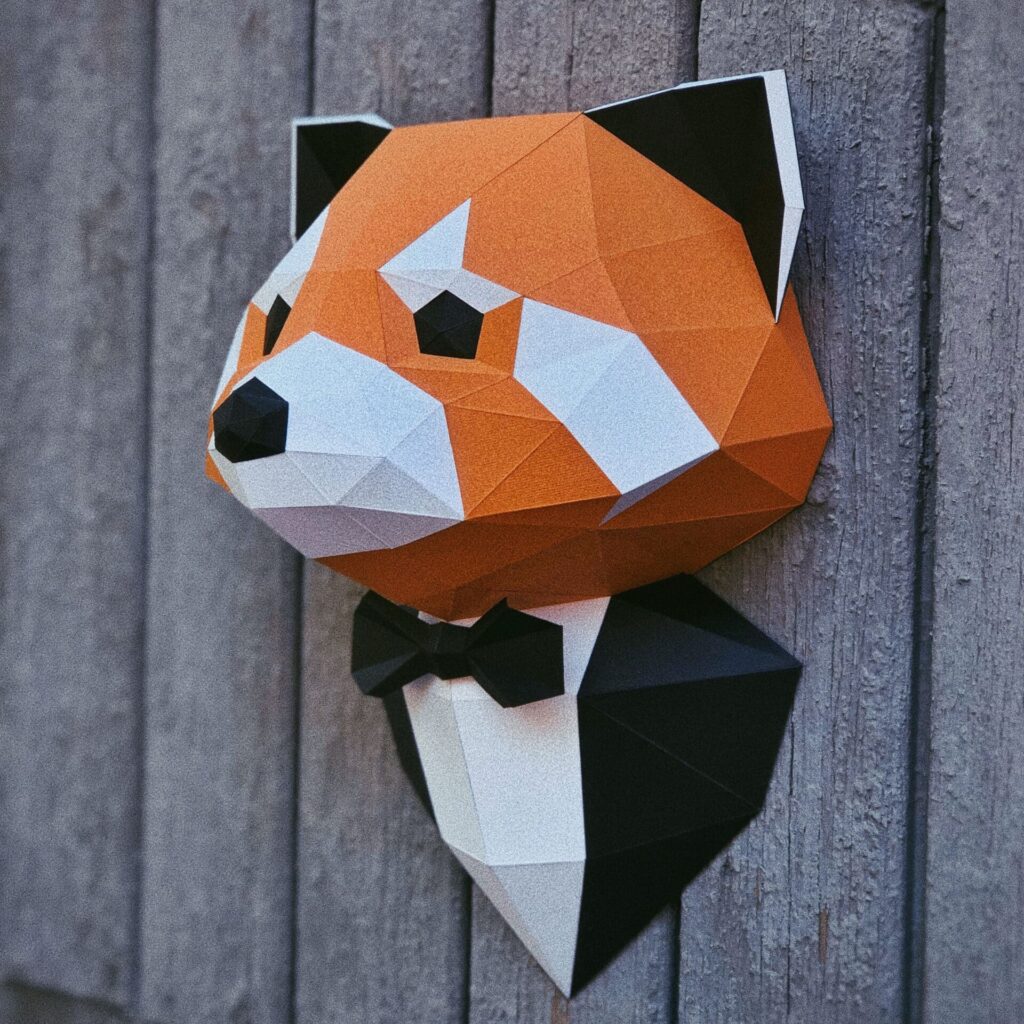Papercraft de panda roux en costume en origami 3D