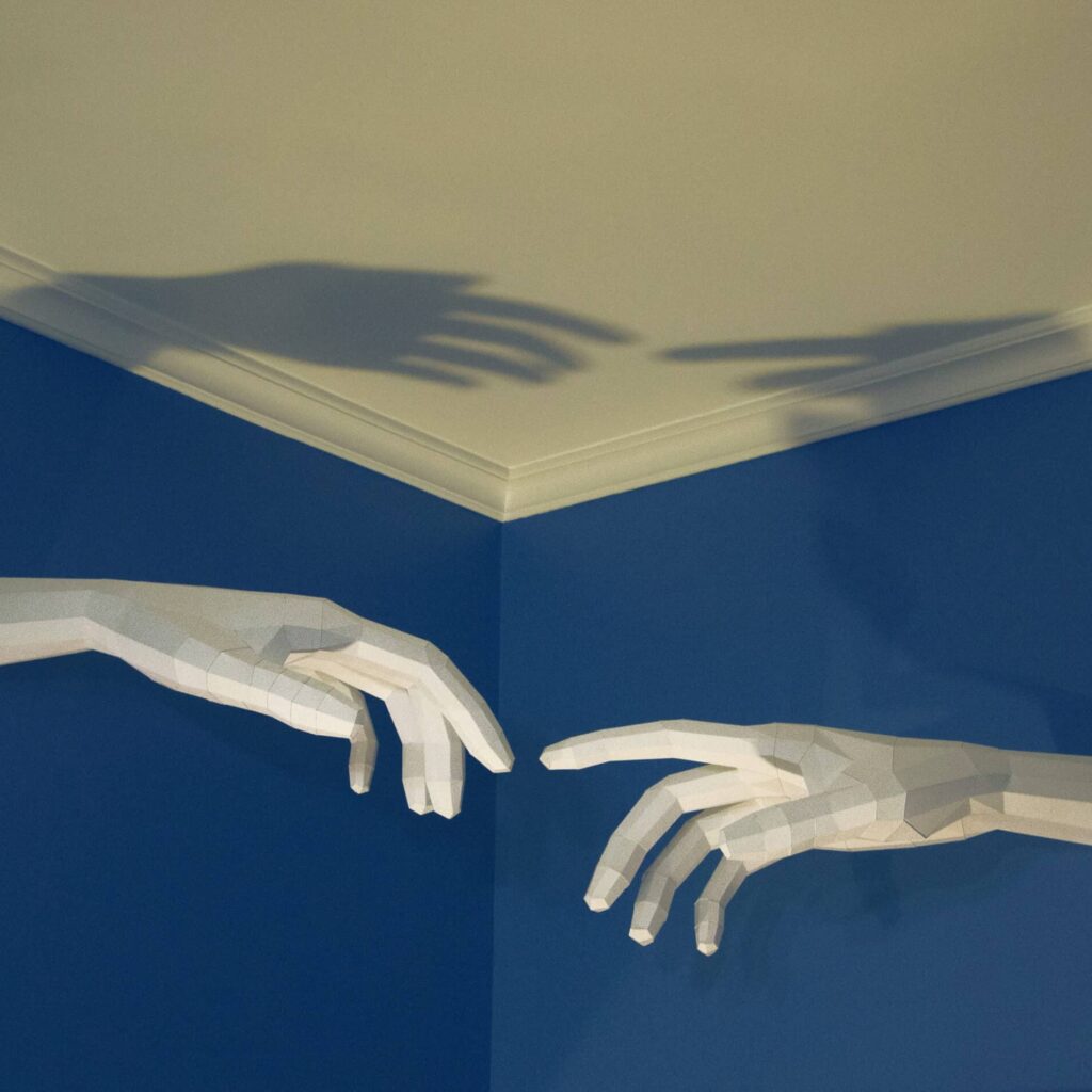 Papercraft of Michelangelo's Creation of Adam in 3D origami