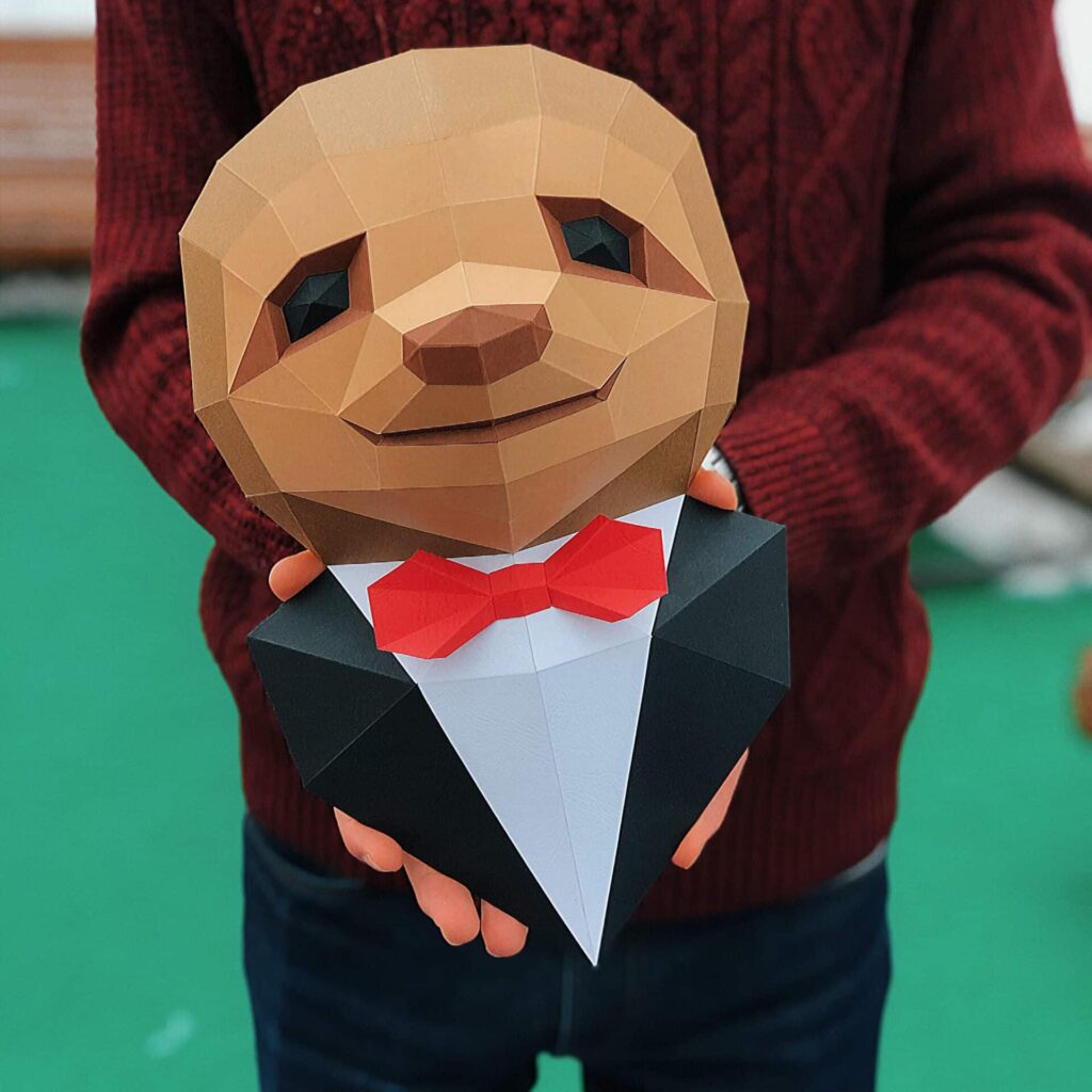 Papercraft of sloth in a suit with 3D origami